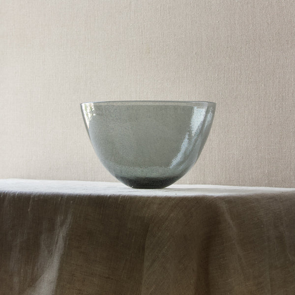 A large tactile bowl in a decorative iridescent blue grey glass. Designed by Swedish designer Erik Holglund.