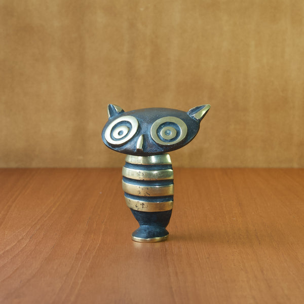 A black and golden mid-twentieth century Austrian brass novelty corkscrew in the shape of an owl bird. This rare and collectable Modernist design by Walter Bosse.