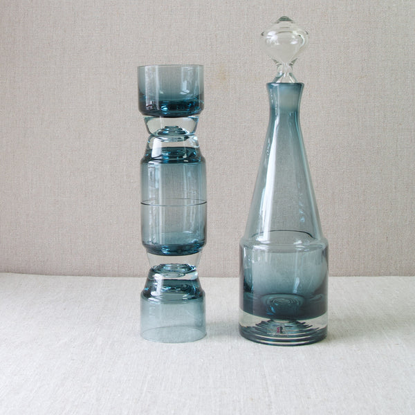 A stack of four Paraati series drinking glasses stood next to a decanter from the same range. The Paraati series was designed by Nanny Still and it it rare. Many other rare and collectable pieces of Scandinavian design can be found on London based Art & Utility's online gallery and web shop.