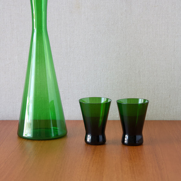 Two Holmegaard drinking glasses in green 