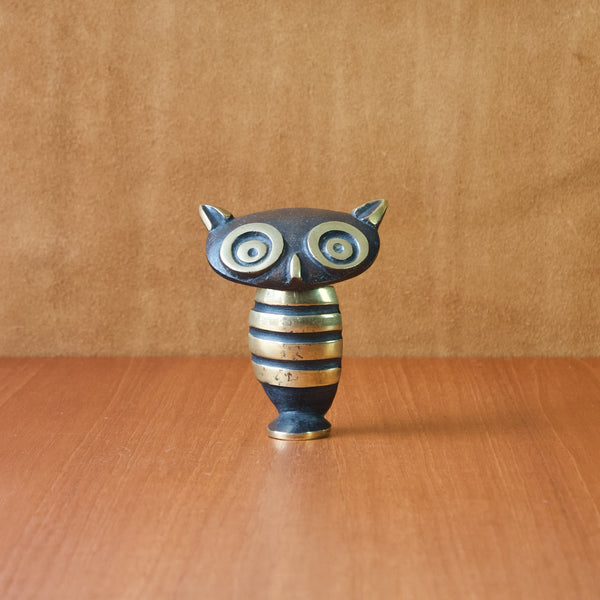 A small black and golden yellow metal owl concealing a corkscrew. This clever and whimsical design is by Walter Bosse who was a leading Austrian Modernist artist.