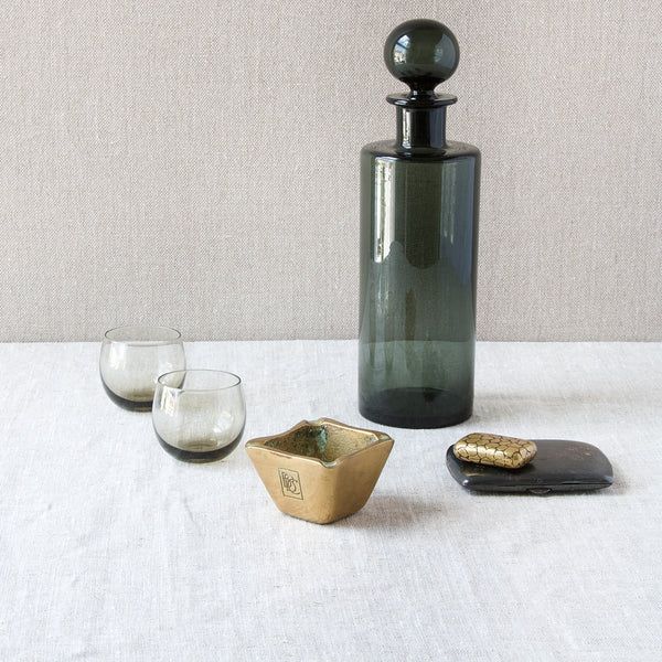 A group of modernist design objects including Richard Rohac tray and Saara Hopea smoke glass decanter