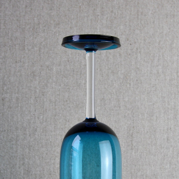 Detail of the clear stem of a blue Nanny Still Harlekiini wine glass made at Riihimaen Lasi Oy 