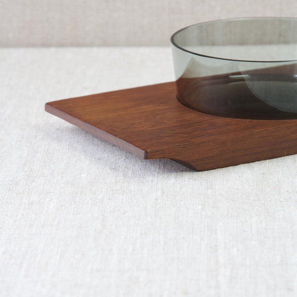 Close up showing the corner of a teak wood tray belonging to an hors d'oeuvre set designed by Saara Hopea for Nuutajärvi Glassworks, 1955.