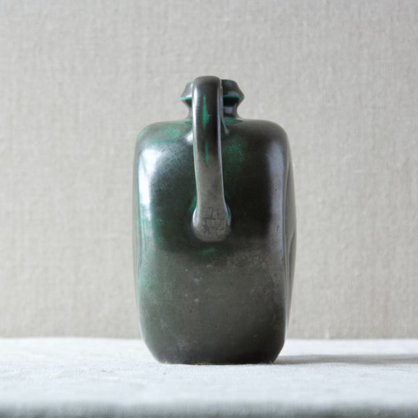 Side view showing hand pulled handle on a ceramic jug pitcher ewer designed by earlt Modernist ceramic and industrial designer Harald Östergren.